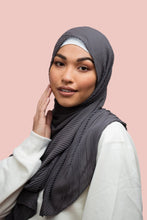 Load image into Gallery viewer, A woman wearing a gray pleated chiffon hijab.